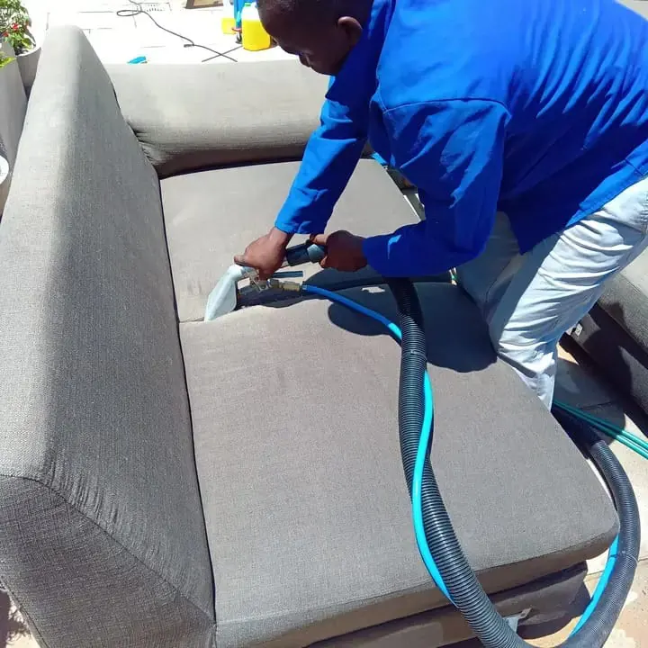 Upholstery extraction cleaning on a fabric sofa